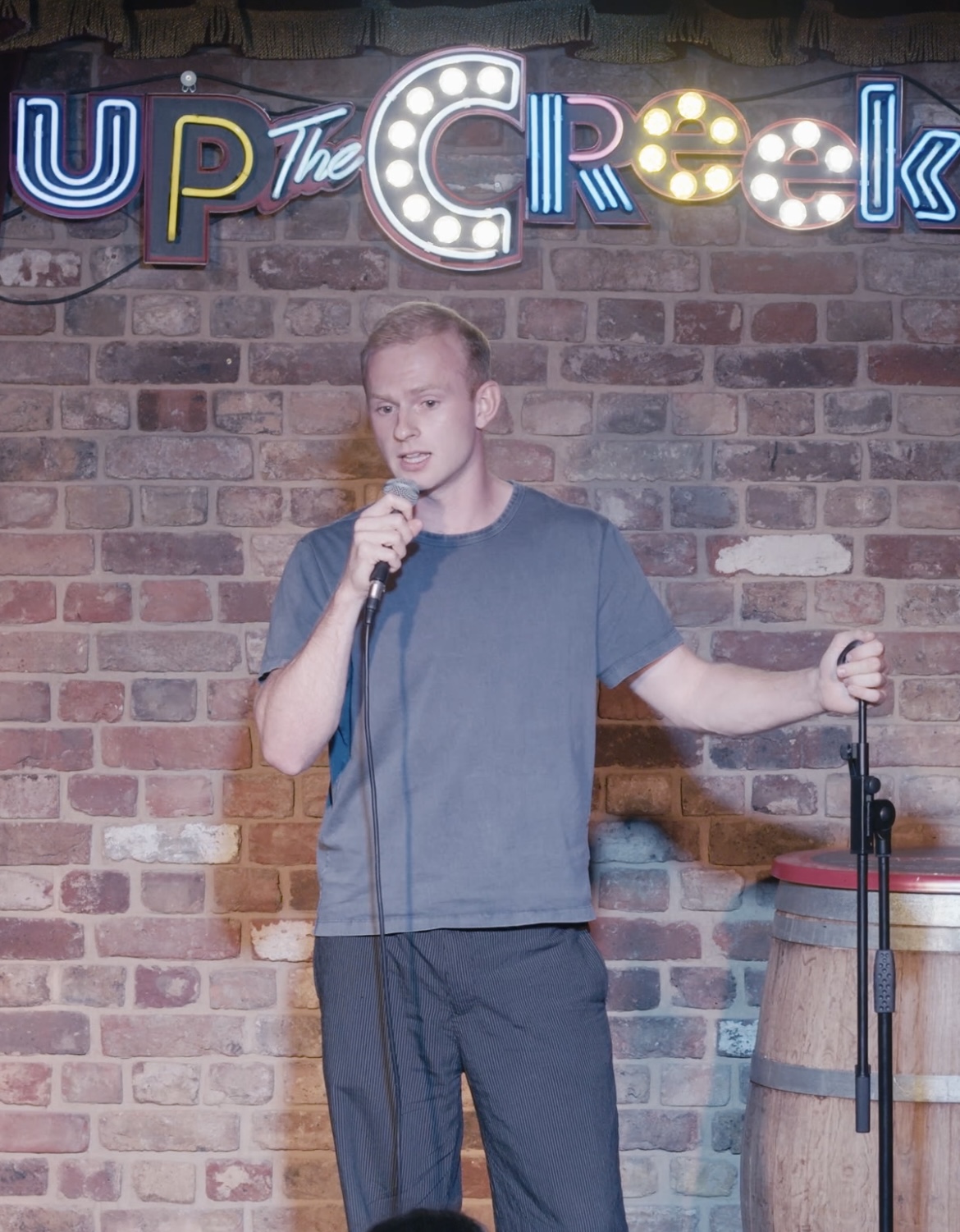 Josh Murphy performing on stage at Up the Creek.